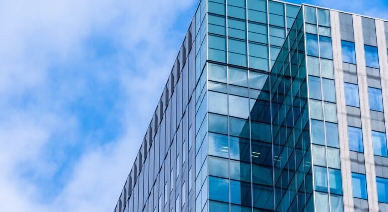 Contemporary corporate office building design by Divyakush Constructions – blending style and functionality